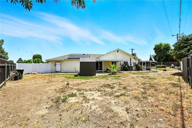 2842 Pietro Dr, Hacienda Heights, CA 91745 - back of house with roof mounted solar panels and a fenced backyard