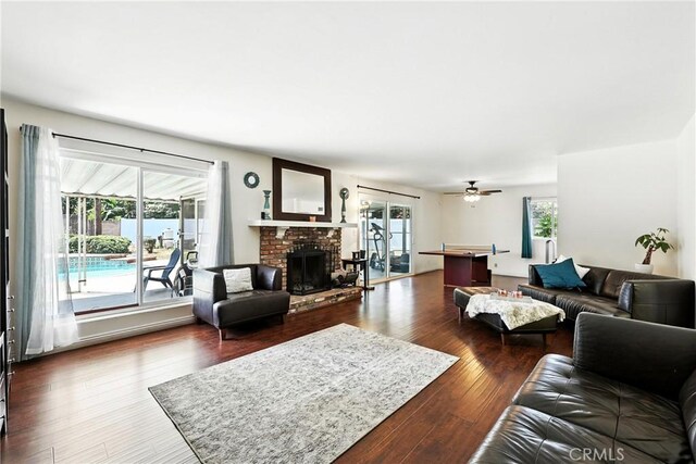 2842 Pietro Dr, Hacienda Heights, CA 91745 - living room with a brick fireplace, ceiling fan, and wood finished floors