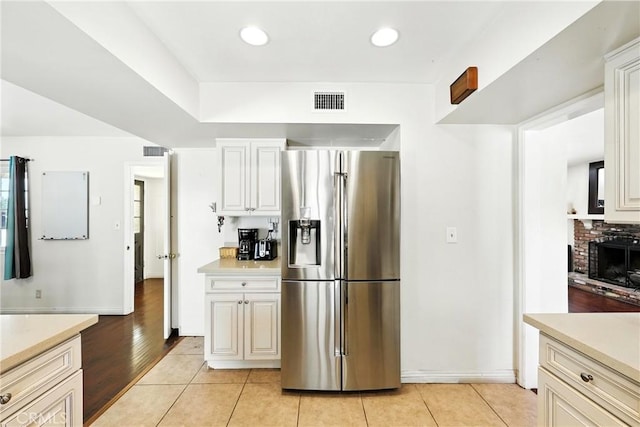 2842 Pietro Dr, Hacienda Heights, CA 91745 - kitchen featuring stainless steel fridge with ice dispenser, light countertops, light tile patterned flooring, and recessed lighting
