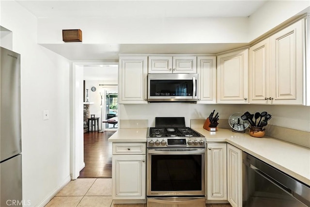 2842 Pietro Dr, Hacienda Heights, CA 91745 - kitchen with appliances with stainless steel finishes, light countertops, and light tile patterned floors