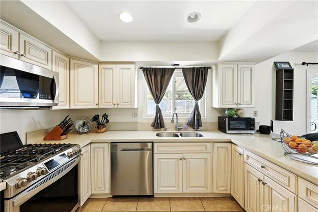 2842 Pietro Dr, Hacienda Heights, CA 91745 - kitchen with appliances with stainless steel finishes, light countertops, and light tile patterned floors