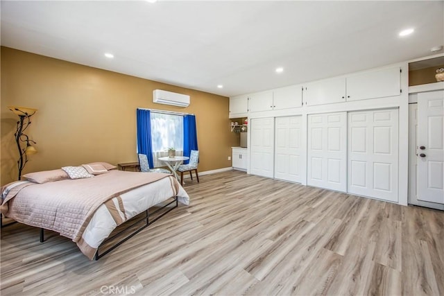 30993 Palo Alto Dr, Redlands, CA 92373 - bedroom with a wall mounted air conditioner, light wood-style flooring, recessed lighting, a closet, and baseboards