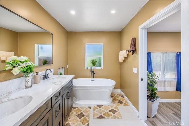 30993 Palo Alto Dr, Redlands, CA 92373 - full bathroom with a soaking tub, double vanity, baseboards, and recessed lighting