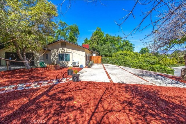 30993 Palo Alto Dr, Redlands, CA 92373 - rear view of property with a chimney and stucco siding