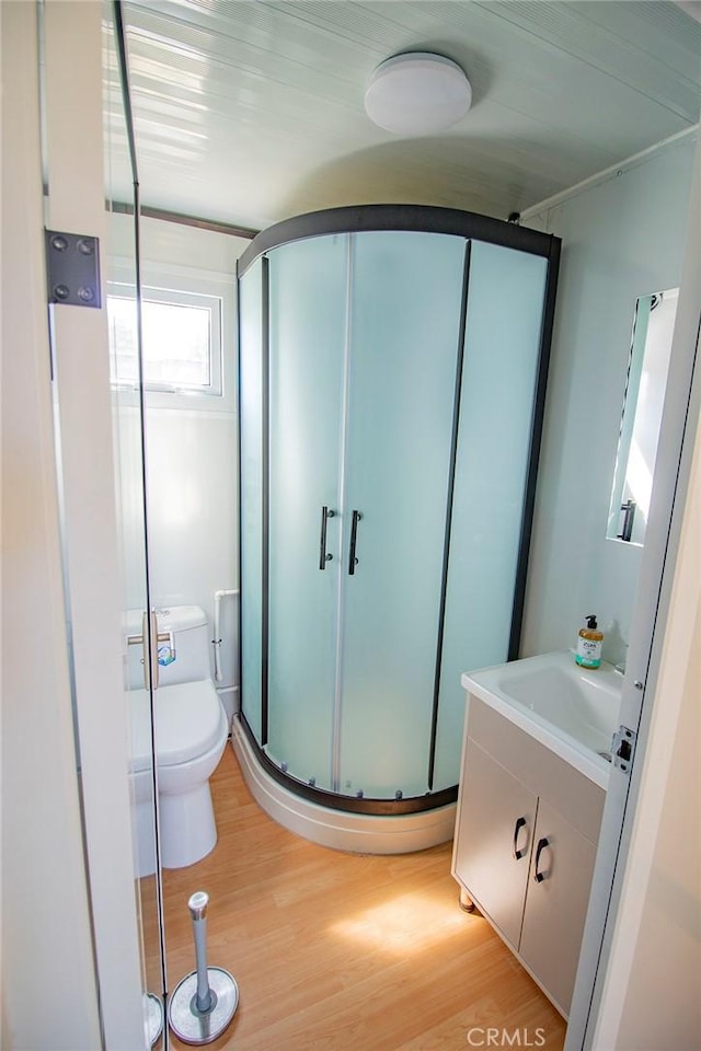 968 Calle Fresa, Nipomo, CA 93444 - bathroom featuring vanity, toilet, a shower stall, and wood finished floors