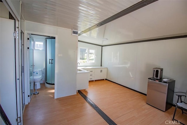 968 Calle Fresa, Nipomo, CA 93444 - unfurnished room featuring light wood-style flooring, plenty of natural light, a sink, and lofted ceiling