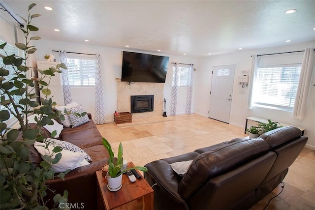 968 Calle Fresa, Nipomo, CA 93444 - living area with recessed lighting, a tiled fireplace, and baseboards