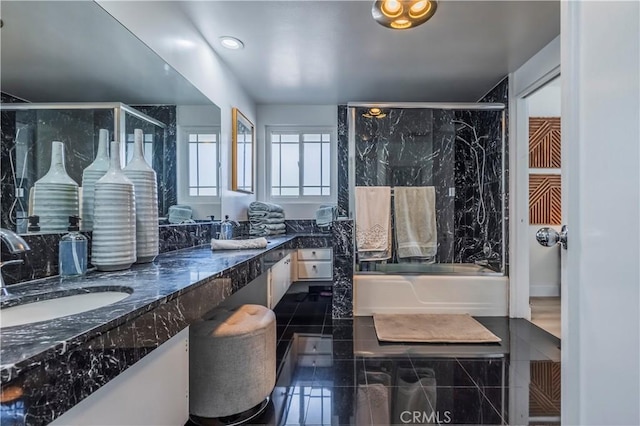 full bathroom with a shower with door, double vanity, a bath, and a sink