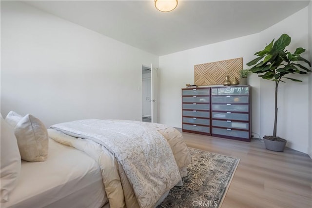 bedroom with light wood-style flooring