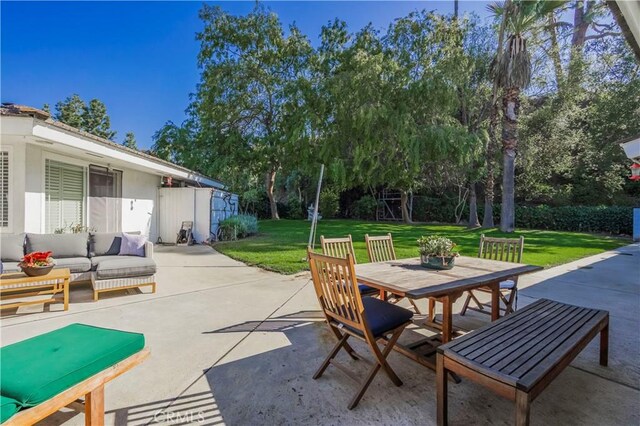 view of patio featuring an outdoor living space and outdoor dining area
