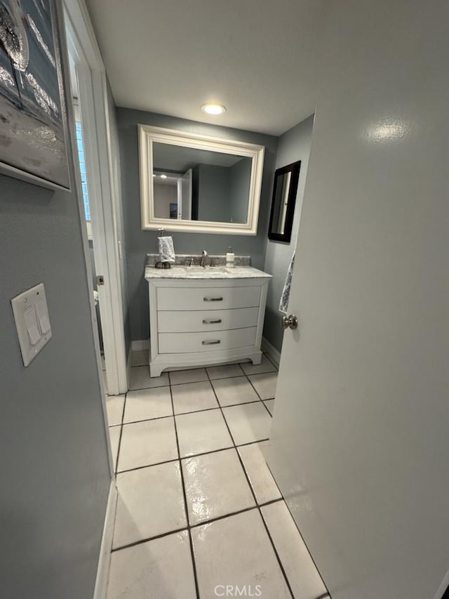 2244 Cannes Sq, Oxnard, CA 93035 - bathroom featuring tile patterned flooring, baseboards, and vanity
