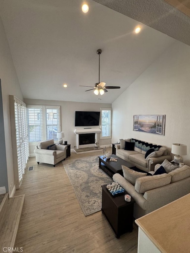 2244 Cannes Sq, Oxnard, CA 93035 - living room featuring lofted ceiling, ceiling fan, light wood-style flooring, recessed lighting, and baseboards