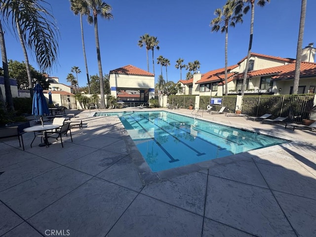 2244 Cannes Sq, Oxnard, CA 93035 - community pool with a patio area, fence, and a residential view