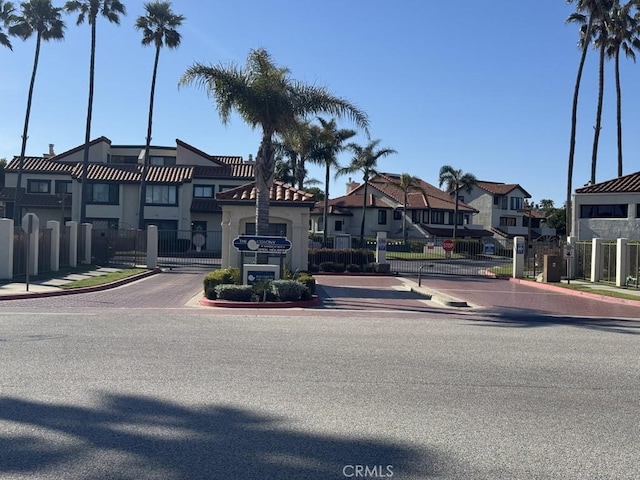 2244 Cannes Sq, Oxnard, CA 93035 - view of front of home with a gate, a residential view, fence, and central AC unit