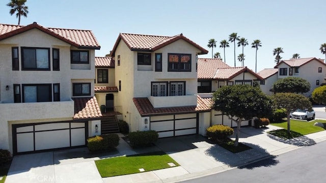 2244 Cannes Sq, Oxnard, CA 93035 - view of front of home with an attached garage, concrete driveway, and stucco siding