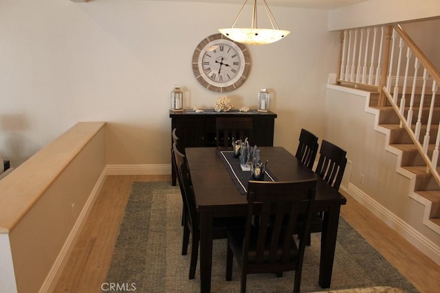 2244 Cannes Sq, Oxnard, CA 93035 - dining area with wood finished floors, stairway, and baseboards