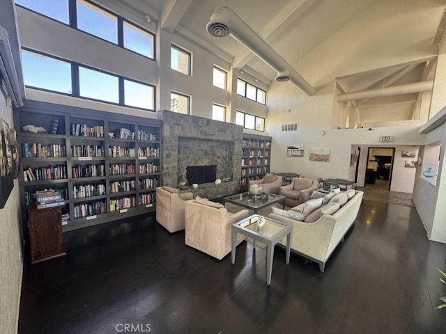 2244 Cannes Sq, Oxnard, CA 93035 - living area with high vaulted ceiling, beam ceiling, a stone fireplace, and wood finished floors