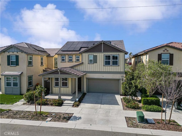 8794 Applewood St, Chino, CA 91708 - view of front of house with solar panels, covered porch, a garage, concrete driveway, and stucco siding