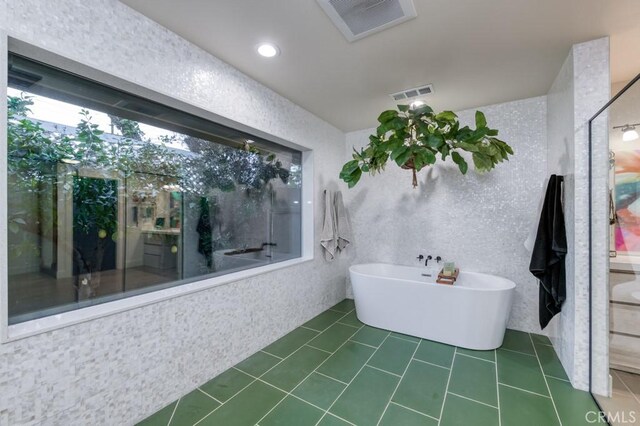 5385 N Van Ness Blvd, Fresno, CA 93711 - bathroom featuring a freestanding tub and tile patterned floors