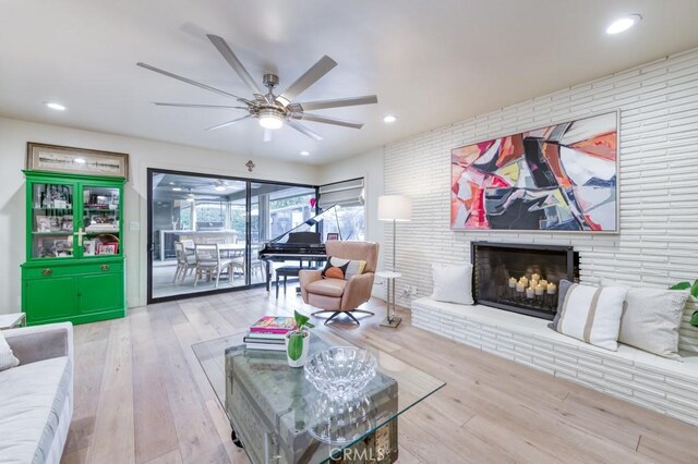 5385 N Van Ness Blvd, Fresno, CA 93711 - living area featuring ceiling fan, wood finished floors, a brick fireplace, and recessed lighting