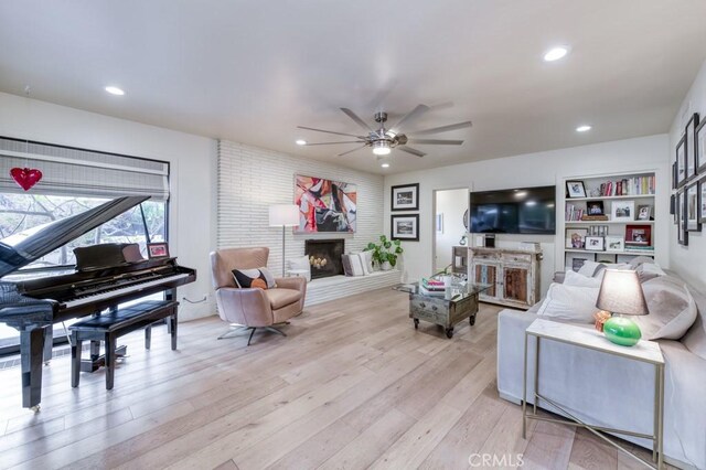 5385 N Van Ness Blvd, Fresno, CA 93711 - living area with a fireplace, ceiling fan, light wood finished floors, and recessed lighting