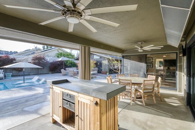 5385 N Van Ness Blvd, Fresno, CA 93711 - view of patio / terrace with ceiling fan, outdoor dining area, an outdoor living space, and area for grilling