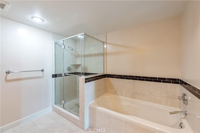 full bath with tile patterned floors, visible vents, a stall shower, and a bath