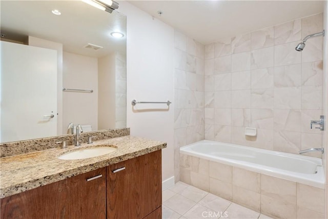 full bathroom with recessed lighting, tile patterned floors, tiled shower / bath, vanity, and visible vents