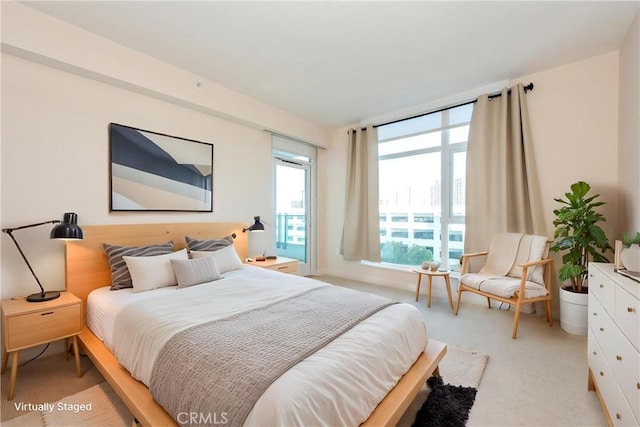 bedroom with light colored carpet