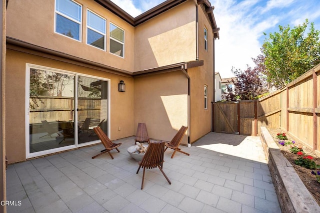 view of patio / terrace with fence and a gate