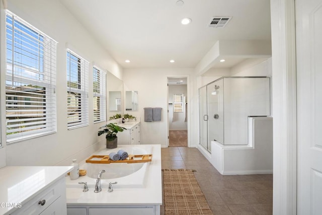 full bath with a shower stall, tile patterned floors, visible vents, and recessed lighting