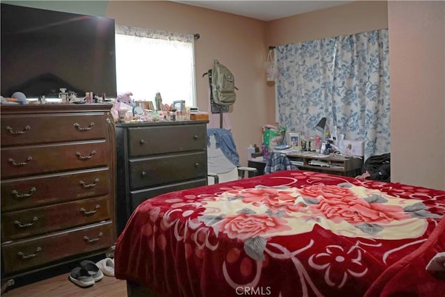 bedroom with wood finished floors