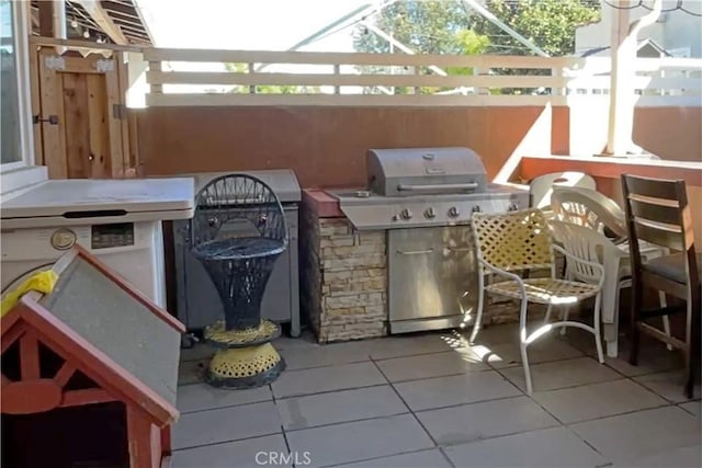 view of patio featuring grilling area and an outdoor kitchen