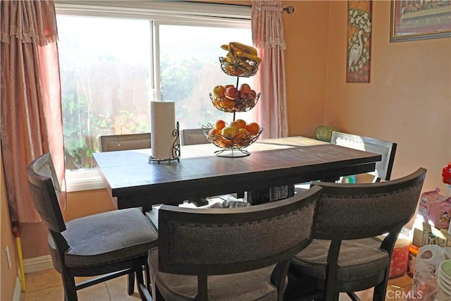 dining area with light tile patterned flooring