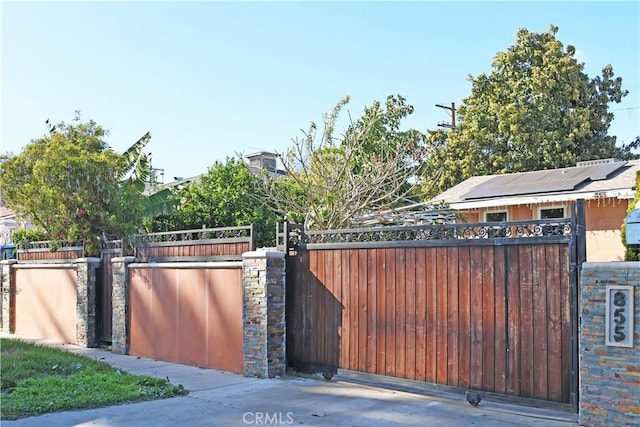 view of gate featuring fence