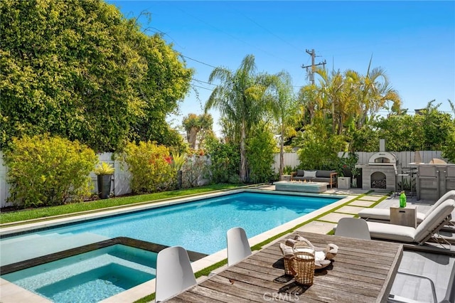 view of swimming pool with an in ground hot tub, a fenced in pool, a patio area, outdoor dining area, and a fenced backyard