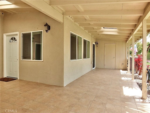 view of patio with a wall mounted AC