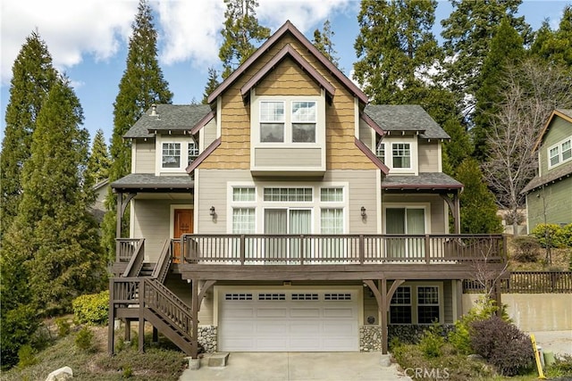 view of front of house with concrete driveway, a shingled roof, stone siding, and an attached garage