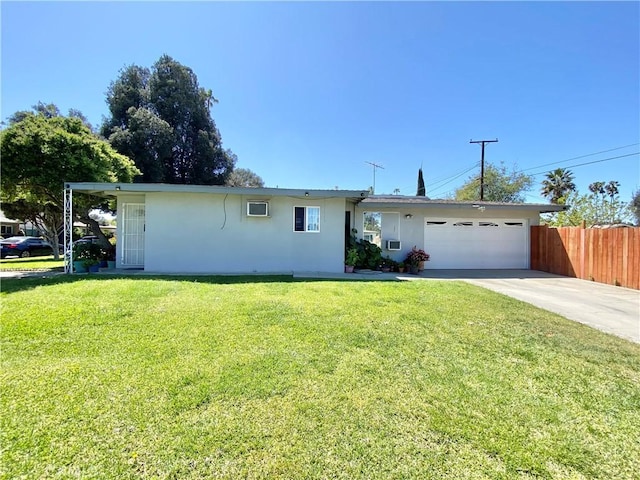 ranch-style home featuring a garage, fence, driveway, and stucco siding