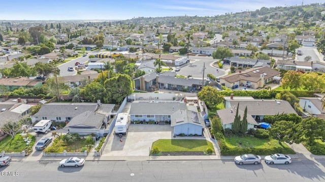 birds eye view of property with a residential view