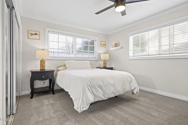 bedroom with light carpet, baseboards, crown molding, and ceiling fan