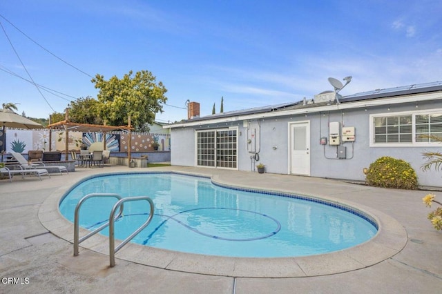 view of swimming pool with a fenced in pool, a patio, and fence