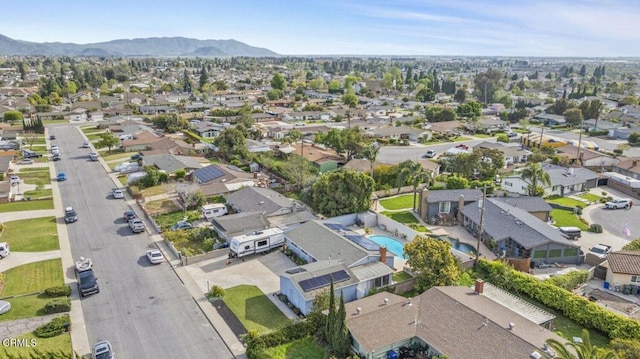 aerial view featuring a mountain view and a residential view