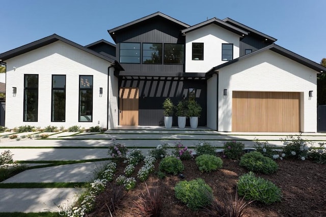 view of front of house featuring a garage and brick siding
