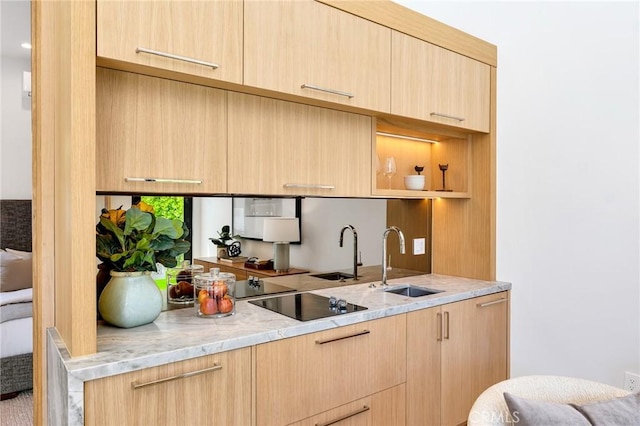 kitchen with light brown cabinetry and modern cabinets