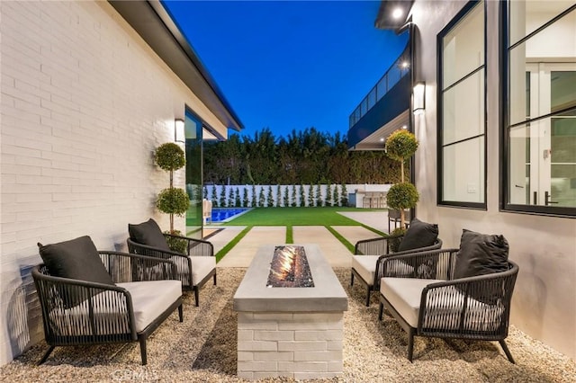 view of patio / terrace featuring an outdoor living space with a fire pit