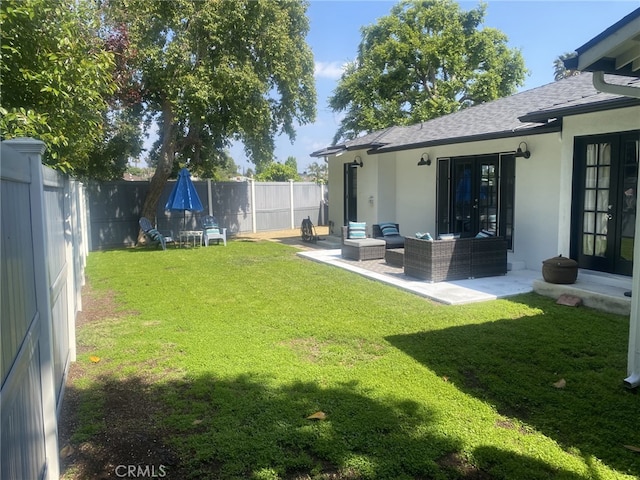 view of yard featuring a patio area, french doors, an outdoor hangout area, and a fenced backyard