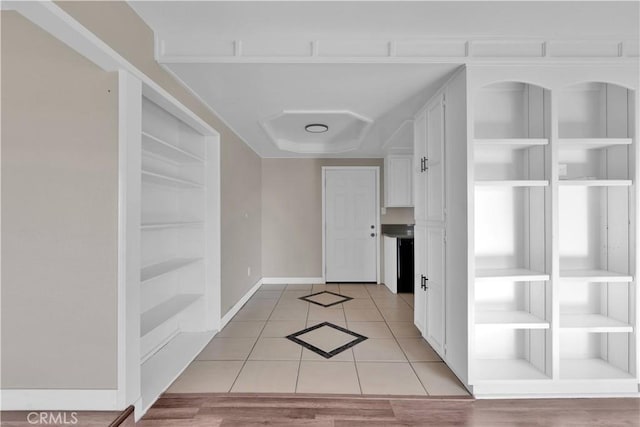 17908 Birch St, Hesperia, CA 92345 - corridor featuring built in shelves, light tile patterned flooring, and baseboards