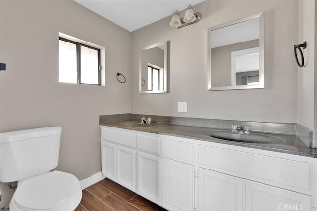 17908 Birch St, Hesperia, CA 92345 - full bath featuring a sink, toilet, double vanity, and wood finish floors