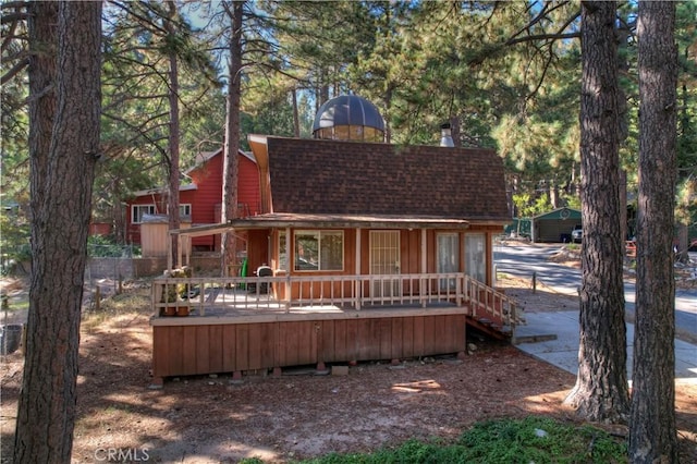 31867 Wagon Wheel Dr, Running Springs, CA 92382 - rear view of house with roof with shingles and a porch